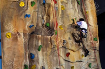 Little boy Climbing A Wall