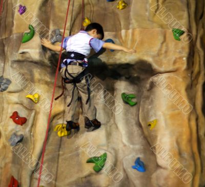 Little boy Climbing A Wall