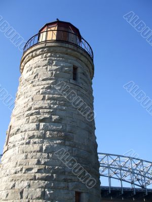 Antique Lighthouse and Modern Bridge