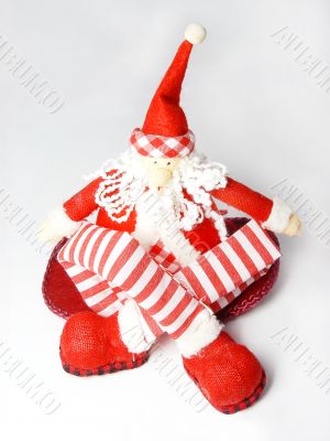 sitting santa claus toy with long legs