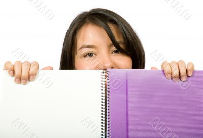 beautiful student looking over notebook