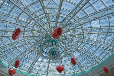 Glass dome with red hearts ballons