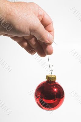 Holding a Christmas Ornament