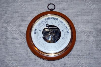 A barometer on the wall
