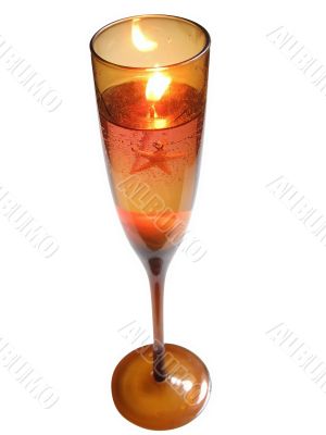 Candle in wineglass