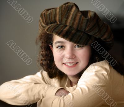 Smiling girl in a hat