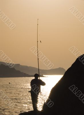 Silhouette of the fisherman