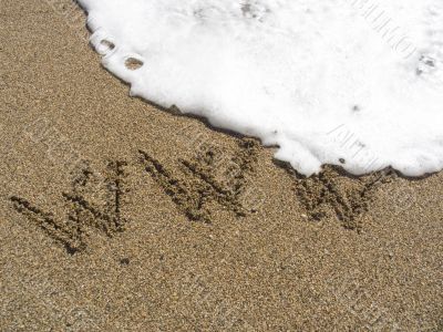 Inscription on sea sand WWW