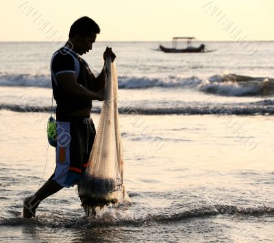 Man fishing in a sunset