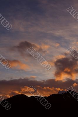 Sunset with clouds and mountains
