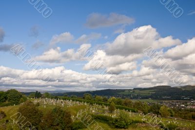 Stirling cemetery under a cloudy sky
