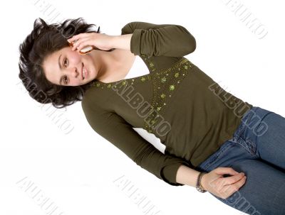 girl talking on a cellphone on the floor