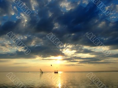 The sky and the sun in clouds above a gulf 2
