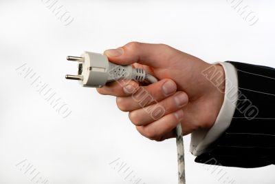 hand with an electric plug