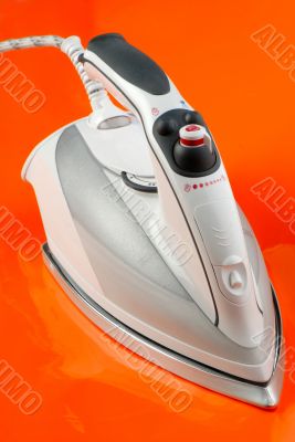 iron on orange background