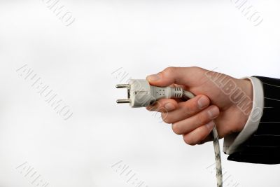 hand with an electric plug