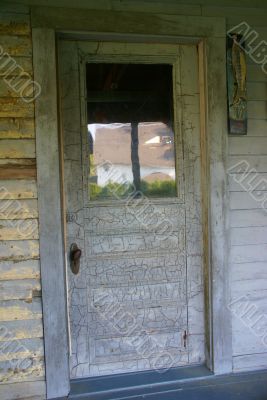 Old door on farmhouse porch