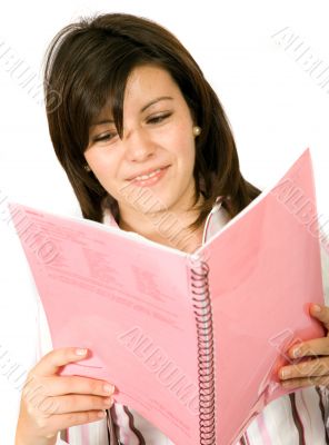 beautiful student reading a notebook