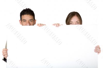 couple holding white banner