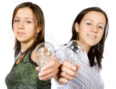 sisters holding lightbulbs