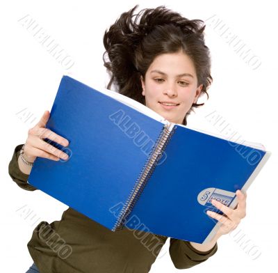 female student reading on the floor