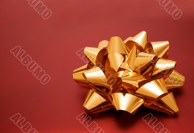 beautiful golden ribbon on red gift
