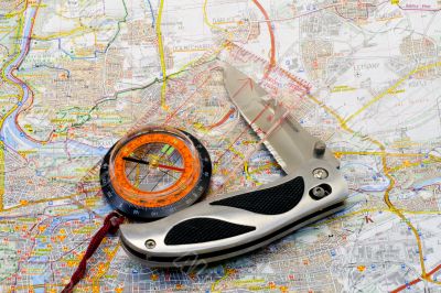 Compass and knife on a map
