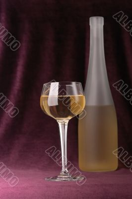 Glass and bottle of white wine