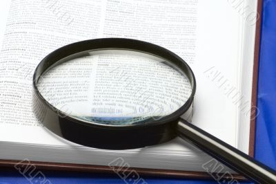 Handglass on a book