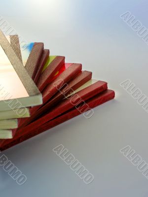 Pile of softcover books with red spines