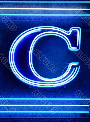The letter `C` in neon