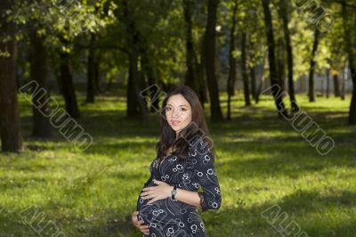 Pregnant woman in park #2