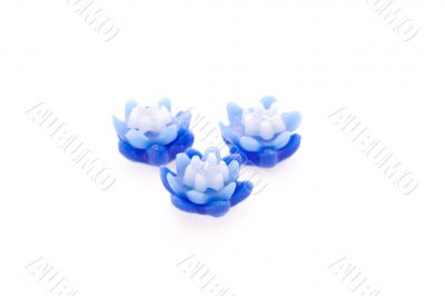 Three blue christmas candles isolated on white