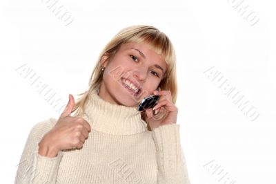 Smiling girl with mobile phone with good idea gesture
