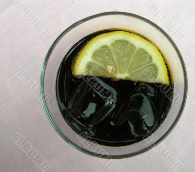 Glass of cola with citron