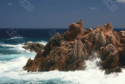 Rocks by the heavy sea