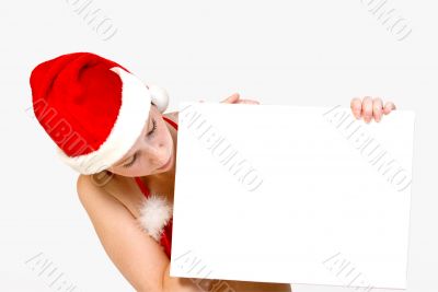 Christmas girl holding up a white sign