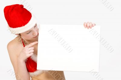 Christmas girl holding up a white sign