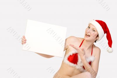 Christmas girl holding up a white sign
