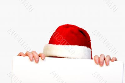 Christmas girl holding up a white sign