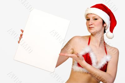 Christmas girl holding up a white sign