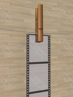 Film hanging on a cord. 3D image.