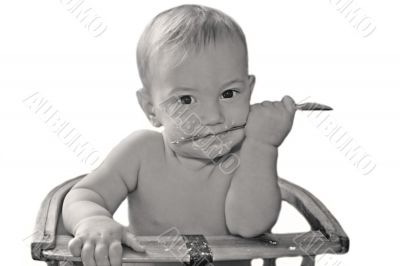 baby boy with spoon over white