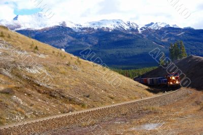 Freight train hauling up the Rocky Mountains