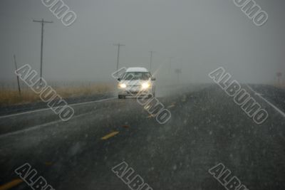 Traffic moving through fog
