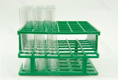 Glass tubes in green plastic holder