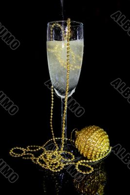 glass of champagne and christmas decoration
