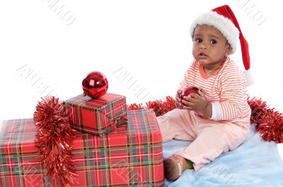 baby girl with christmas presents