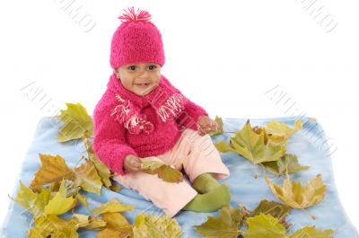 Baby playing with leaves