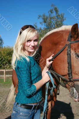 female model with brown horse close-up portrait
